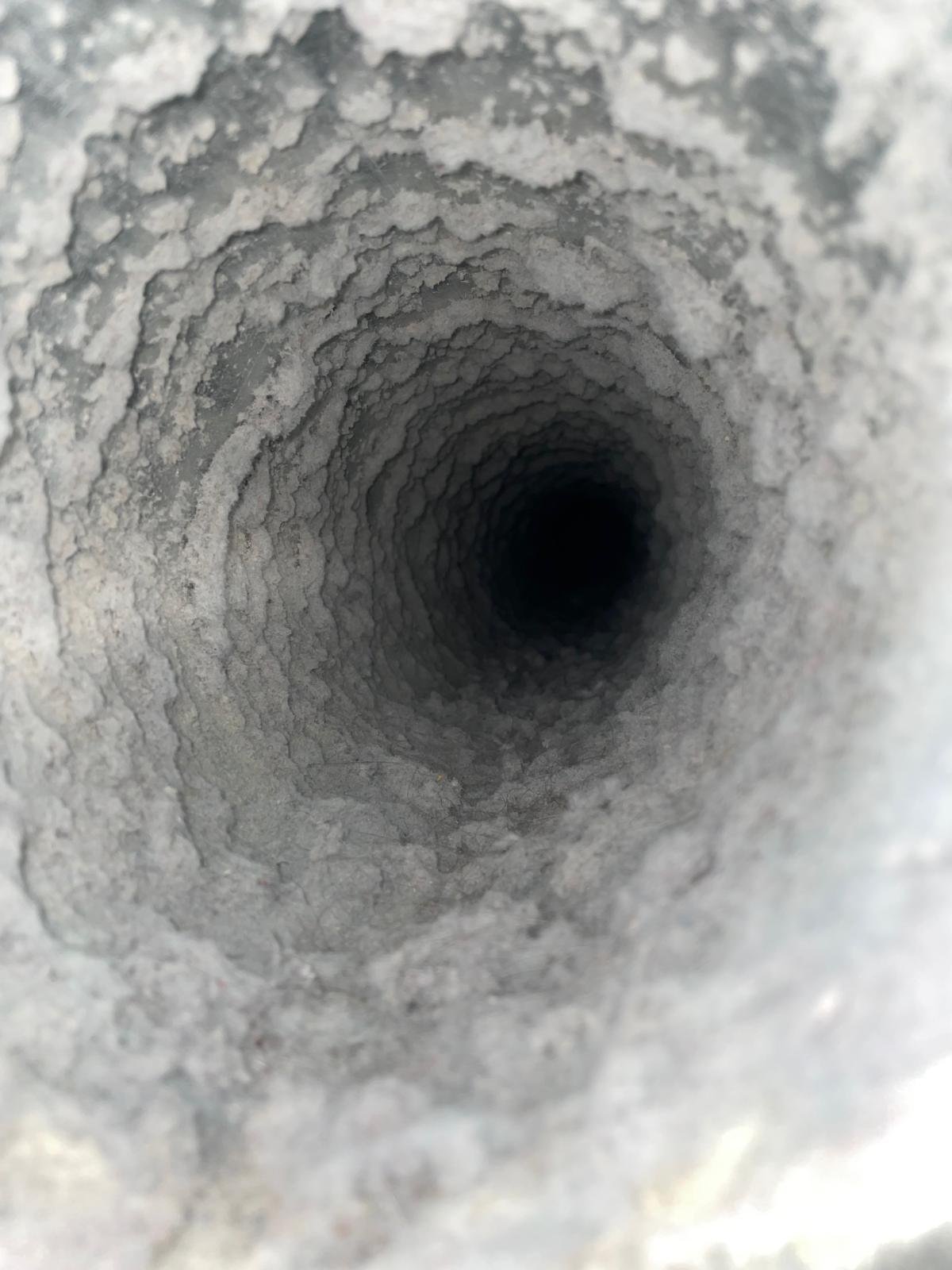 Dryer vent duct packed with heavy lint buildup before cleaning in Sugar Land, TX 77498